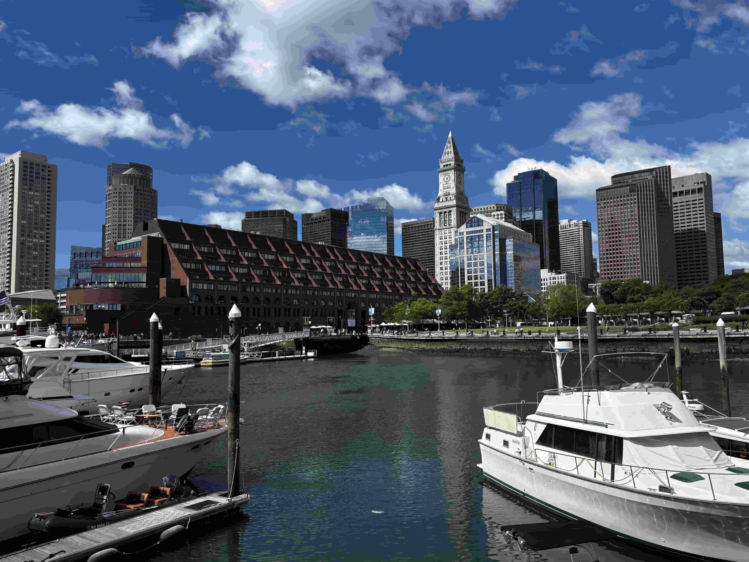 City skyline with boats in harbor